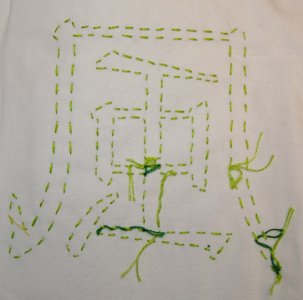 Kanji f&uuml;r Wind in hellgr&uuml;nem Vorstich, umschlungen in Dunkelgr&uuml;n. R&uuml;ckseite.